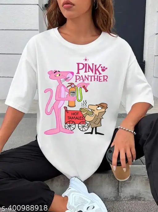 White woman wearing an oversized pink t-shirt with a cartoon illustration of a pink panther holding a pink handbag