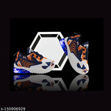 Black shoes with neon blue light-up soles, white laces, and sporty design