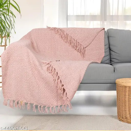 Pink reversible acrylic throw with geometric pattern, ideal for all-season comfort and versatile usage