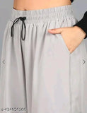 Grey stretchy pants with black drawstring
