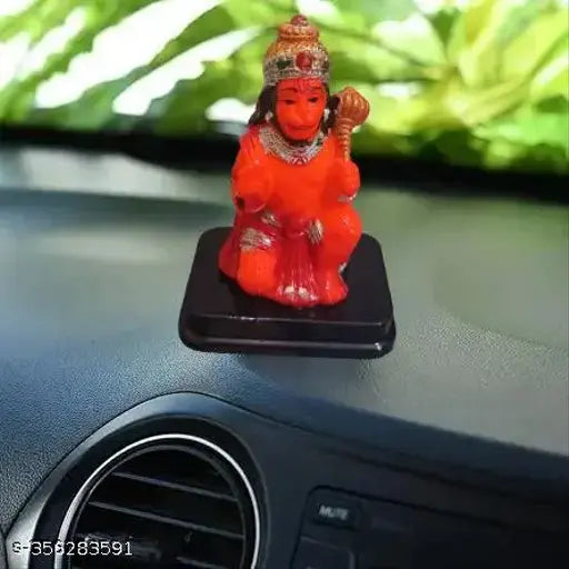 Orange polyresin Hanuman ji idol for car dashboard, symbolic of strength and good luck