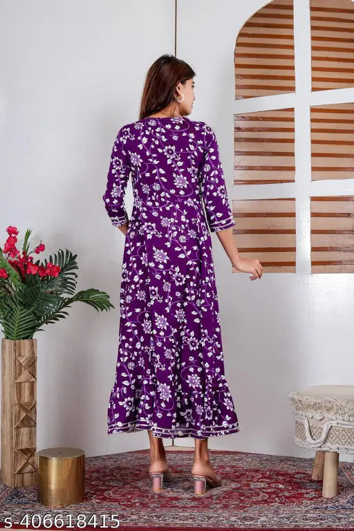 Multicolor print rayon Anarkali gown with embellishments, perfect for women's festive or daily wear. Laxmi Fab Tex design, three-quarter sleeves." (108 characters)