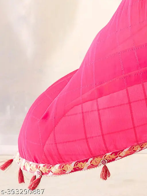 Magenta silk saree with gold tassel trim and traditional pallu