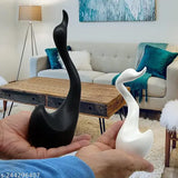 Large white and black Mariners Creation Lucky Swan ceramic figures, set of 2 for home decor. Exquisitely crafted, high-quality bird & animal showpieces, 8cm x 11cm x 24cm each. Perfect for versatile home decor or as a thoughtful gift. Made in India