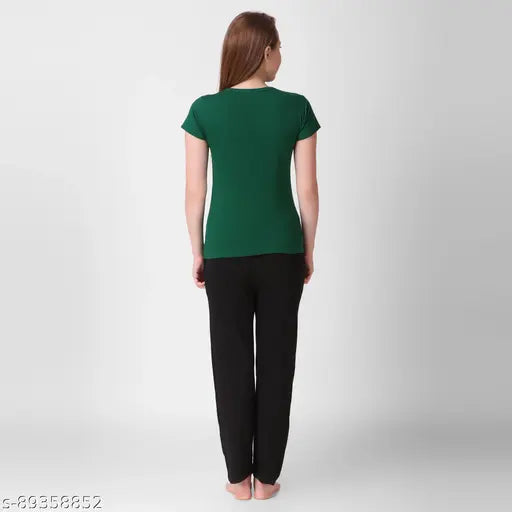Green top and black pants in style