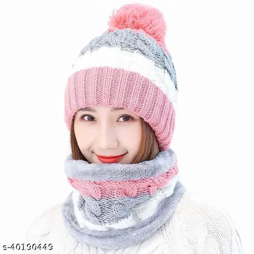 A pink and gray knit beanie cap, styled inside a fur-lined scarf or muffler