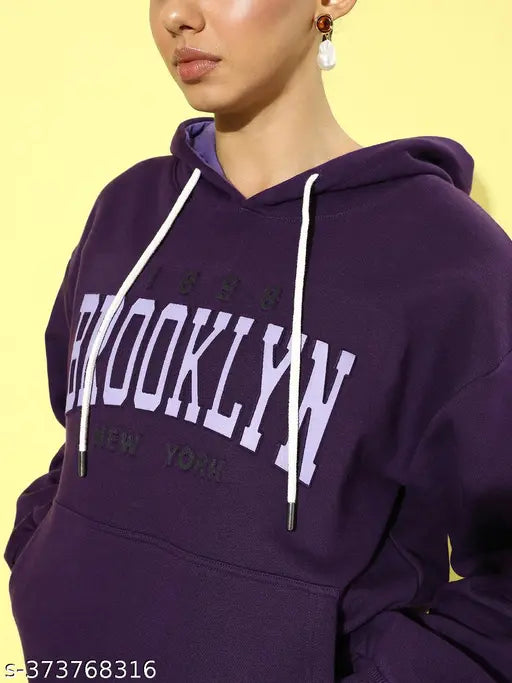Purple oversized cotton sweatshirt, long sleeves with printed design, women's fashion item on hanger