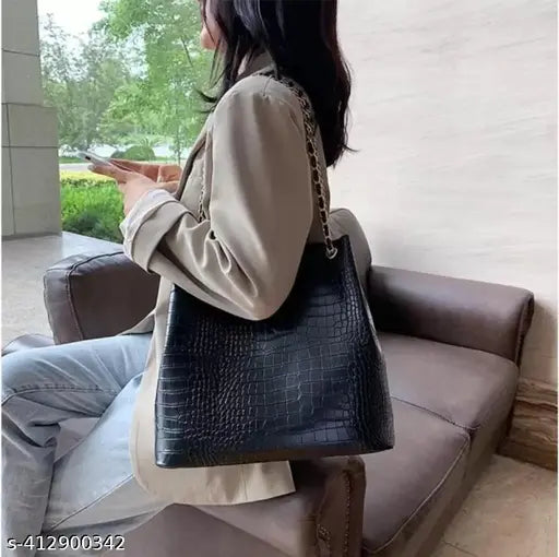 Trendy, black leather crossbody sling handbag with adjustable strap