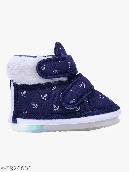 Navy blue canvas and PVC baby booties with printed pattern, slip-on design for 6 to 24 months' foot lengths