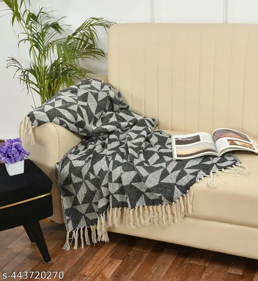 Grey cotton throw blanket, single layer, perfect for couch, bed, and sofa chair. Soft and plush material providing warmth and coziness