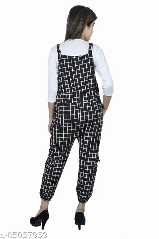 Black cotton blend checkered dungaree dress with adjustable shoulder straps, ankle length, multi-colors. Great for girls' casual wear, trendy design with distress look. Made from stretchable fabric and stainless steel lock. Perfect for everyday use and weekends outings. Indian origin