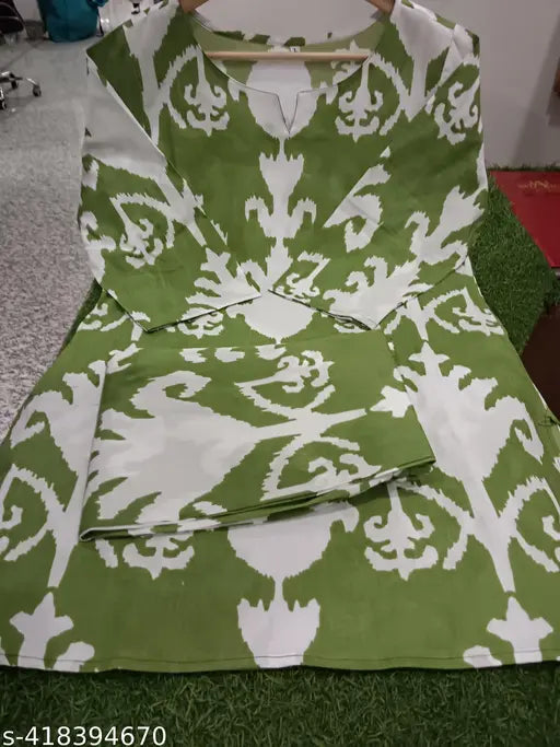 Green cotton printed night suit top & pyjama coord set for women, featuring three-quarter sleeves, comfortable fit, and stylish print design. Made in India