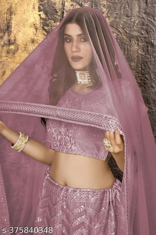 Pink net embroidered lehenga choli and dupatta set with ethnic motifs, semi-stitched (waist size: 44in, lehenga length: 42in, dupatta length: 2.25in), originating from India
