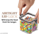 A clear plastic airtight storage container in a modern style, containing multiple colorful gummy bears, with a transparent lid and handle