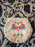 A woven, handcrafted purse with intricate patterns and beaded accents