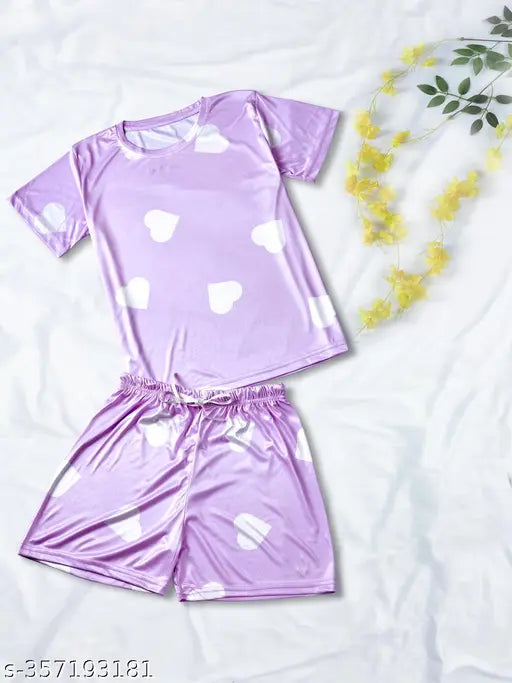 Heart print lavender color silk blend night suit set for ladies, featuring a t-shirt, pajama, and shorts with drawstring elastic waistbands. Made in India
