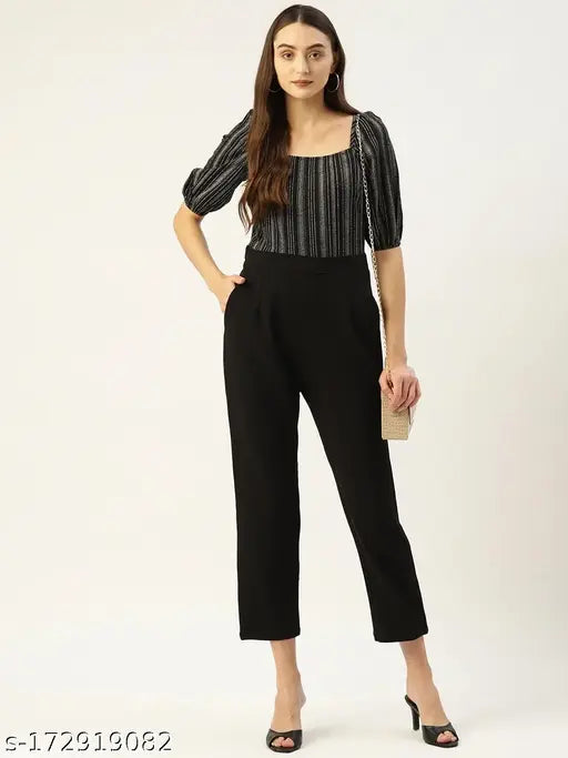 Black & White striped basic jumpsuit by Magnetic Designs, crepe fabric with short sleeves, on model standing