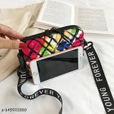 A sling box bag with a new design, featuring multicolored fabric and drawstrings closure