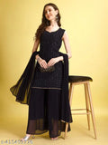 Black embellished sari with dupata, styled on a wooden stool