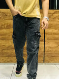 The image shows a pair of dark blue baggy jeans with ripped knee details
