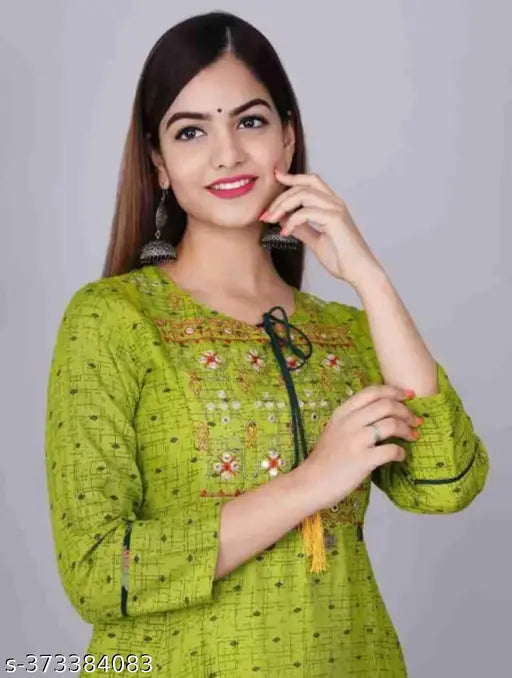 Green rayon Anarkali kurti with three-quarter sleeves, printed combo. Vibrant green, subtle embroidery, India origin