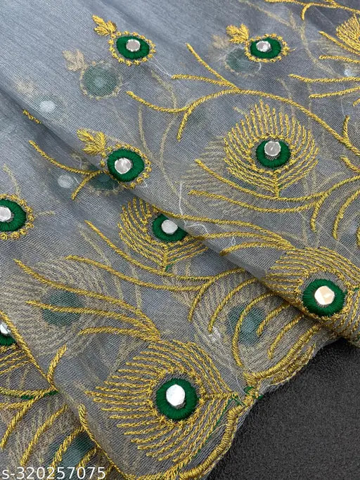 Embroidered feather design mirror work sari in super net fabric, featuring heavy plain banglory silk blouse with cutwork border and multi-thread embroidery. Available in mustard yellow, off white, black, steel gray, and sky blue colors. Indian made free size (5.5m saree length, 0.8m blouse length)