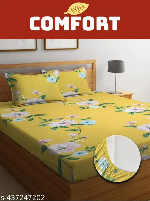 Floral print elastic fitted double bedsheet with 2 pillow covers, cotton, 78x72x8 inches. Elasticized for a snug fit on double beds and easy maintenance. Breathable, soft, and durable printed cotton design enhances home decor. Made in India