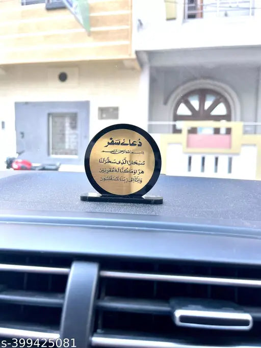 Black and gold Safar Dua for car dashboard, traditional Indian accessory on dash board
