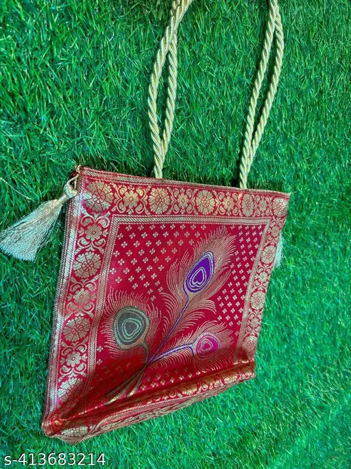 A red paisley handbag with a rope handle