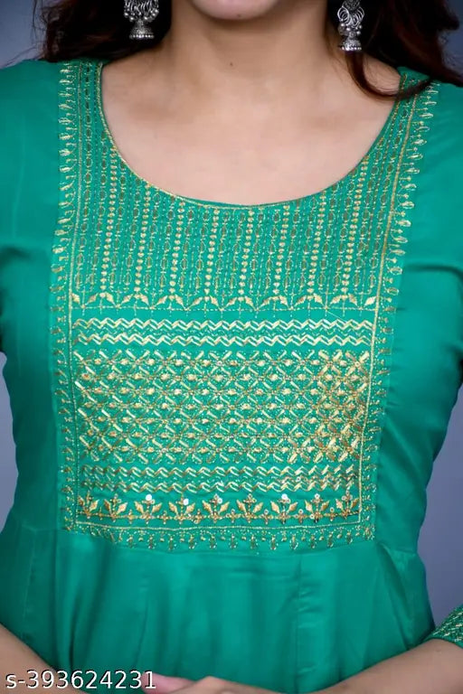 Green traditional anarkali kurta with detailed embroidery, crew neckline