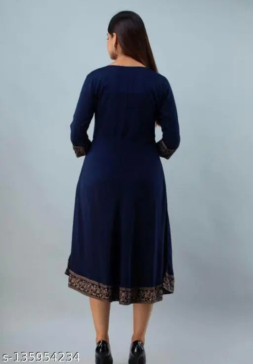 A long, navy blue rayon kameez with a gold print border