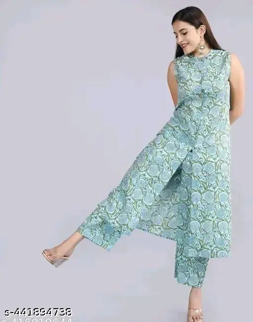 Green rayon kurta with printed net palazzo, three-quarter sleeves, handcrafted Indian fashion on display stand