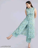 Green rayon kurta with printed net palazzo, three-quarter sleeves, handcrafted Indian fashion on display stand
