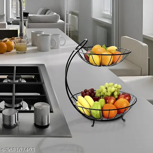 Black metal two tier fruit basket with fresh produce for kitchen countertop