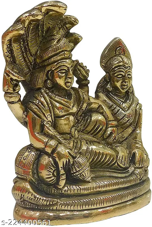 Yellow metal Lord Vishnu with Laxmi resting on Sheshnaag, intricately handcrafted polyresin idol from India, perfect for worship and home decor