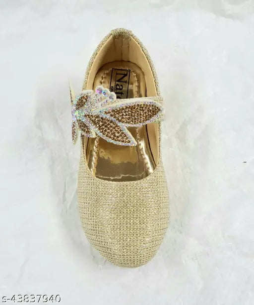 Gold mojari with a butterfly on top