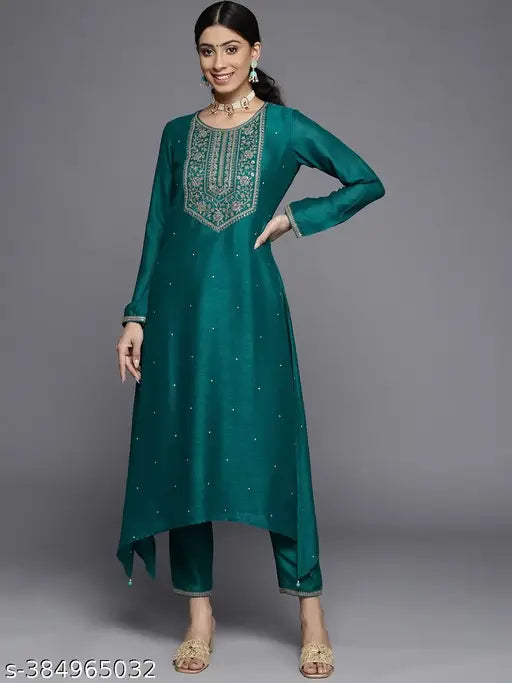 Teal green Vichitra silk kurta with round neckline, three-quarter sleeves, and intricate embroidery details. Ideal for light festivities. Made in India