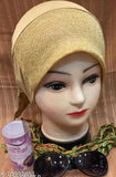 Gold and beige hijab cap with black sunglasses behind it