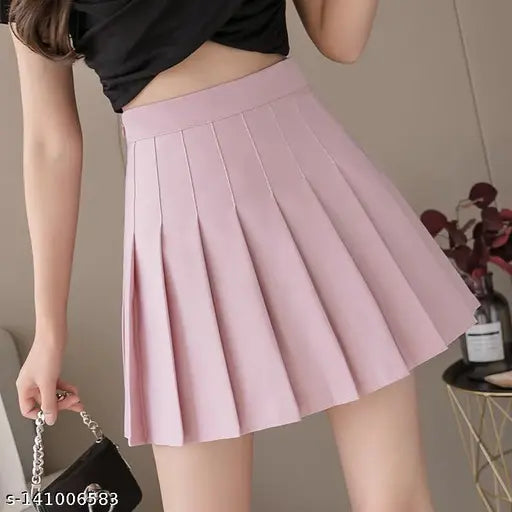 Solid cotton high waist pleated skirt by Caracola Girl, available in multiple sizes from 24-34 inches