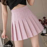 Solid cotton high waist pleated skirt by Caracola Girl, available in multiple sizes from 24-34 inches