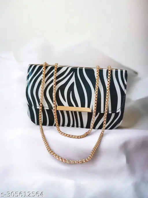 Stylish black zebra print purse with gold accents