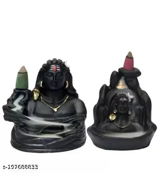 Adiyogi figure and black smoke fountain