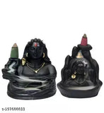 Adiyogi figure and black smoke fountain