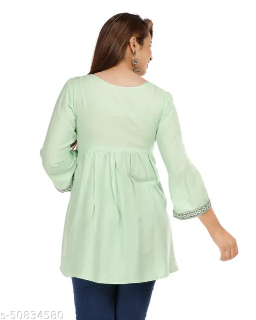 Green rayon casual top, three-quarter sleeves, embroidered net pattern, women's size S (36in bust, 32in length). Elegant and feminine green casual top