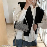 A blue and white pearl chain shoulder bag with a black, patterned lining