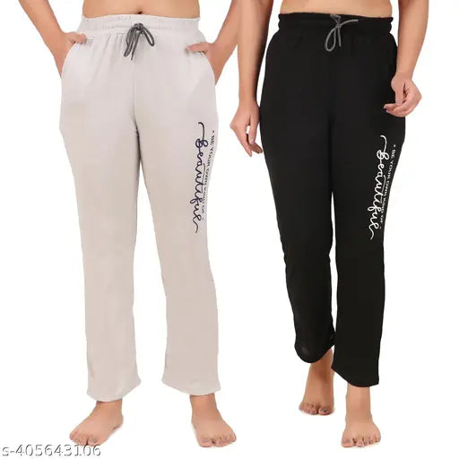 Two-piece pajama set in black and gray fabric with white text on waistband, pack of 2