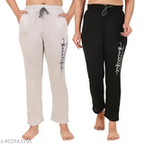 Two-piece pajama set in black and gray fabric with white text on waistband, pack of 2