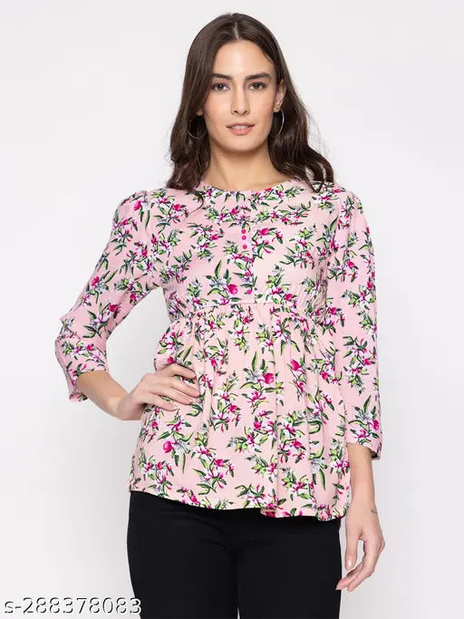 Printed cotton blend women's top with three-quarter sleeves, vibrant pattern on short size