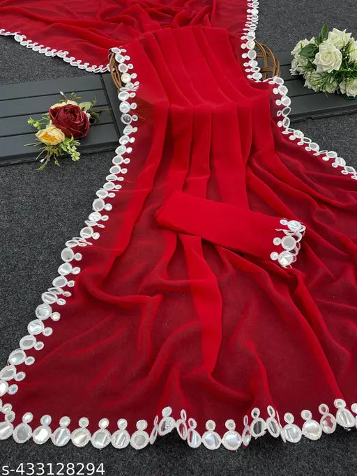 Red saree with intricate embroidery and border detail