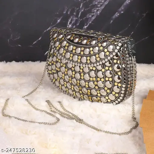 Silver and gold metal party clutch with multiple decorative elements